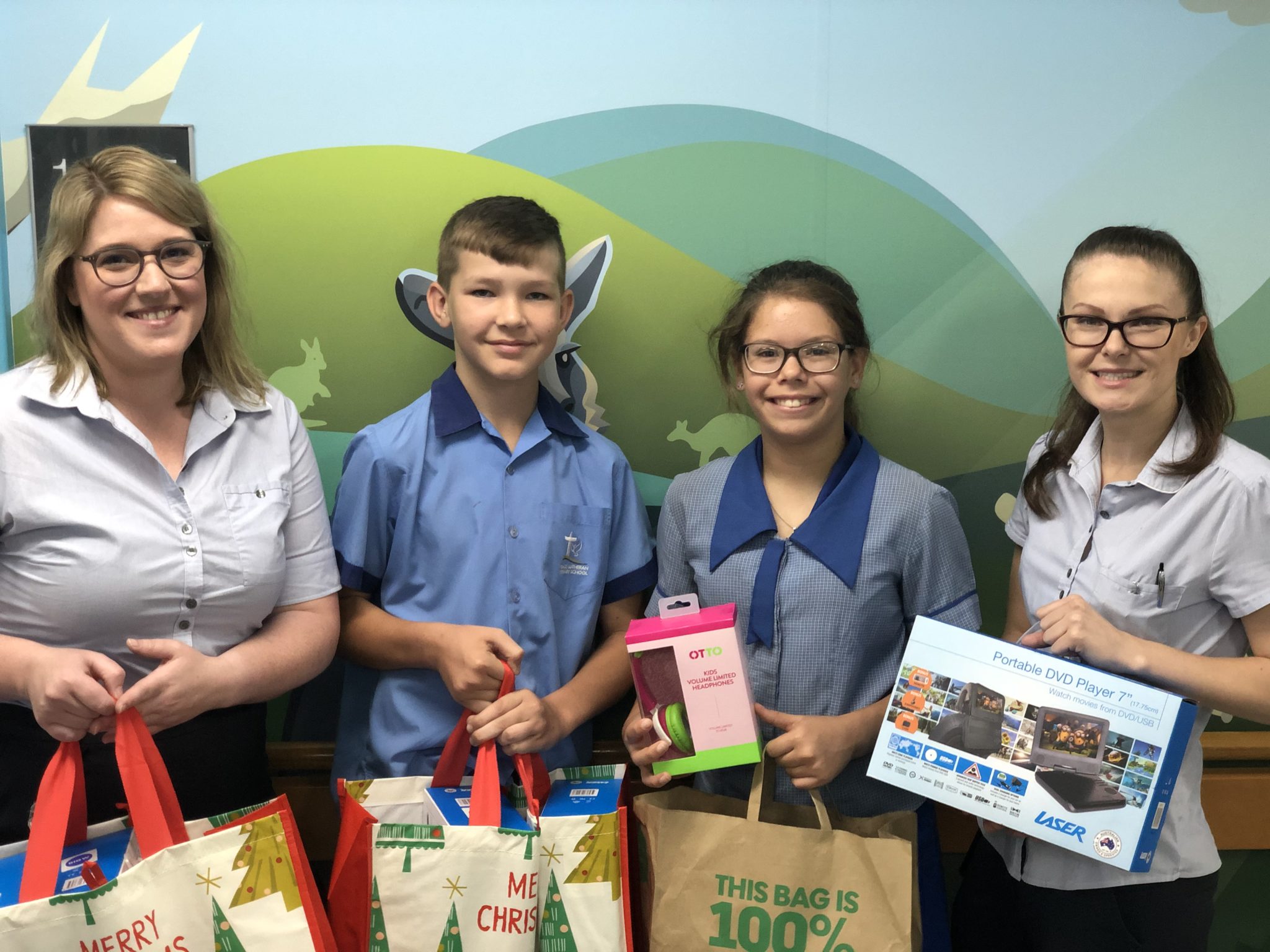 Students from Peace Primary donating gifts to the sunshine ward