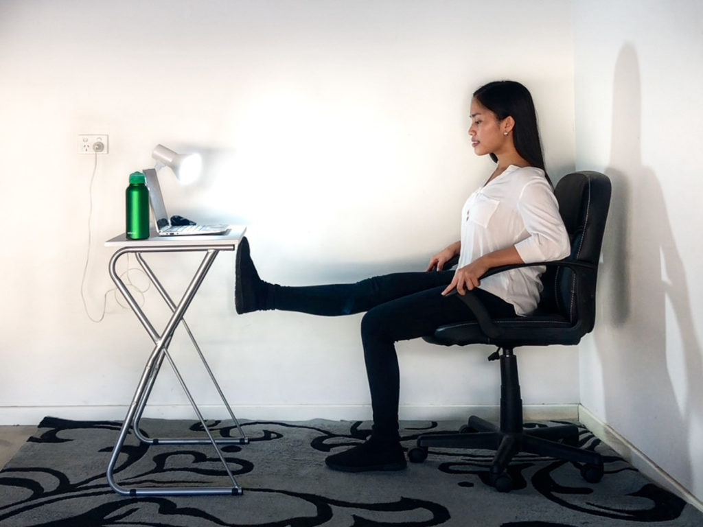 Desk exercise with a leg extension
