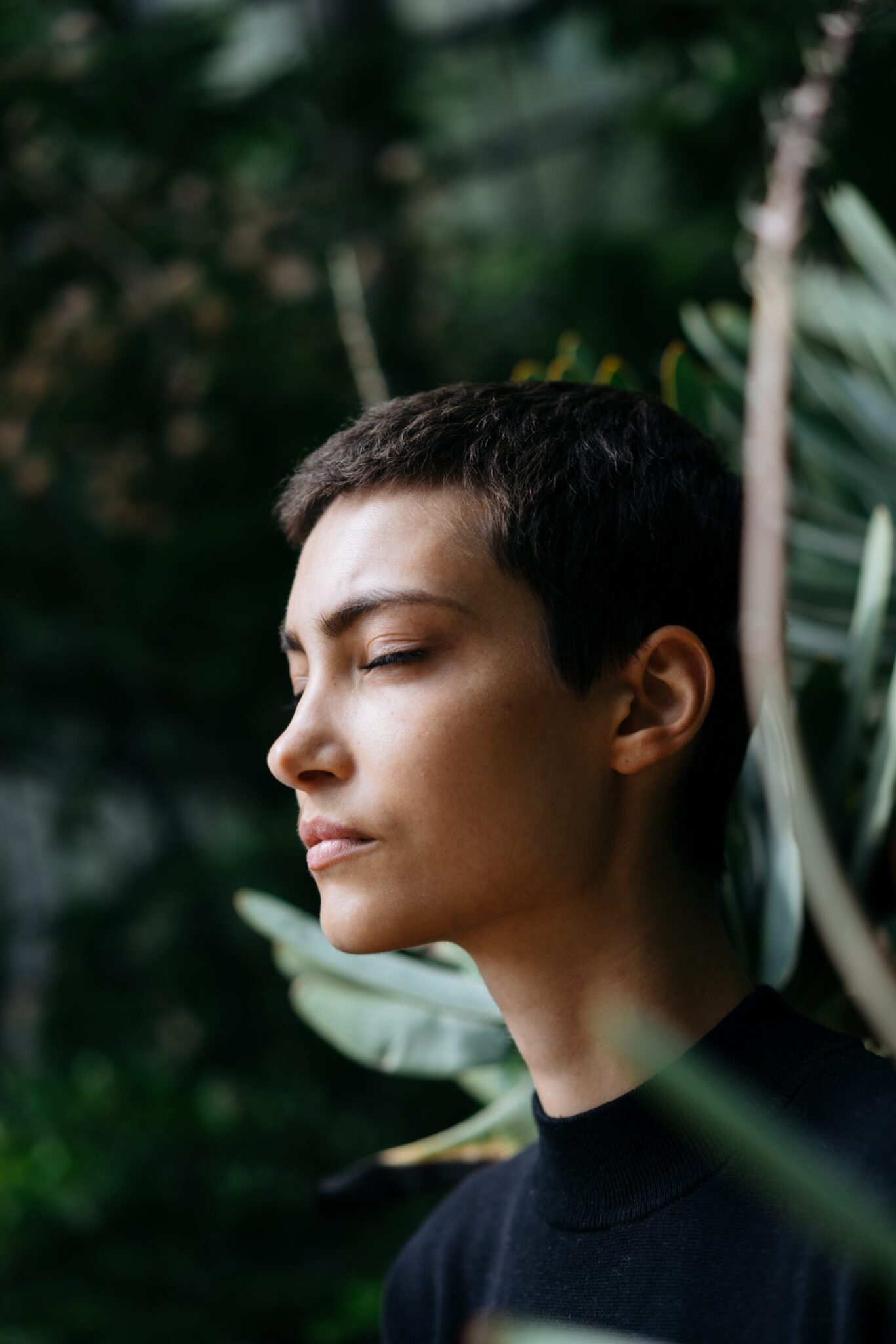 young woman with her eyes closed looking like she's meditating